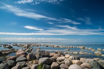 The rocky shore of the Baltic Sea. Beautiful sunny summer day, calm sea. Baltic Sea Estonia Kihnu Island