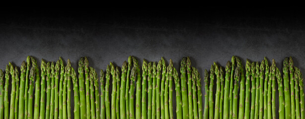 Asparagus on a dark background, copy space. © Галя Дорожинська