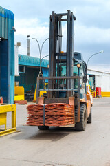A forklift transporting copper cathodes at the plant of a copper mine. © Jose Luis Stephens