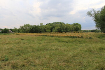 Fototapeta na wymiar A yellow bridge in a field