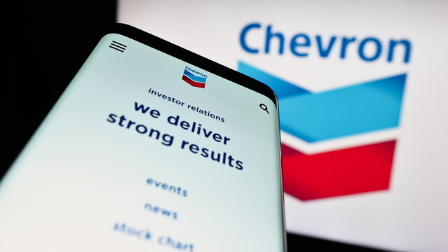 Stuttgart, Germany : 06-25-2023: Mobile phone with website of US energy company Chevron Corporation on screen in front of business logo. Focus on top-left of phone display.