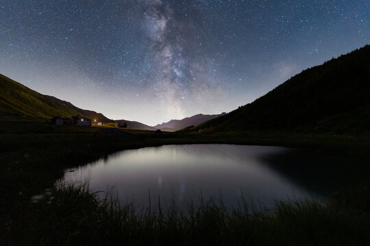 Milky Way over the alpine pond of Pozza Blu, Macolini, Madesimo, Valle Spluga, Valtellina, Lombardy