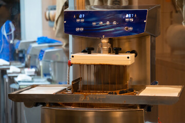 Chocolates being made in a professional kitchen. Production of pralines for the food industry....