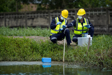 Environmental researchers investigate the condition of canal water for toxic spills, river waste...