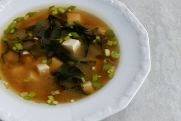 Homemade authentic miso soup with kombu dashi, tofu, wakame seaweed and scallions.