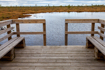 Wooden platform to enter the bog pool in Soomaa National Park. Riisa Bog, Estonia, Europe.