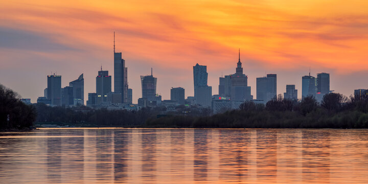 View over River Vistula towards City Centre Skyline at sunset, Warsaw, Masovian Voivodeship, Poland