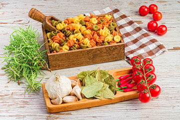 Festival of flavors: Garlic, chillies, tomatoes, bay leaf, rosemary and Italian pasta.