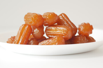 Traditional Turkish dessert tulumba on a plate 