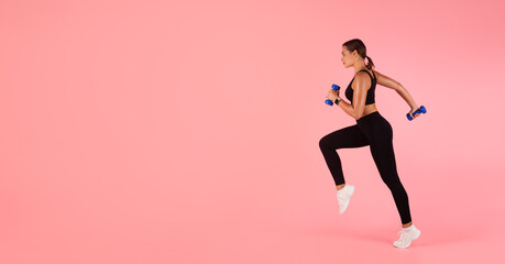 Fototapeta na wymiar Sport Motivation. In Motion Shot Of Sporty Young Woman Running With Dumbbells