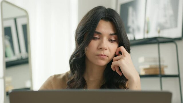 Sad hispanic business woman finishing computer work and closing laptop, looking away with deep thoughts of undone project, seating at workplace feeling stressed dissatisfied by task not done in time