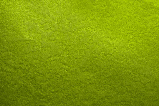 Vintage green textured background. Shiny lime green color texture. Flat lay mockup design. Texture sheet abstract background, wrapping texture.