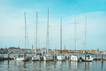 Many boats and yachts anchored at the San Giorgio Maggiore Yacht Harbor in Venice, Italy.