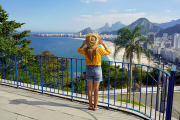 Holidays in Brazil. Full length view of tourist girl looking at Rio de Janeiro cityscape with...