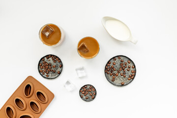 Top view of cold latte coffee with ice and coffee beans