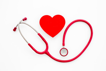 Medical stethoscope and red heart, top view. Health care and heart check concept