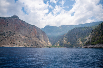 View from water of Butterfly Valley in Oludeniz Fethiye in the morning, Turkey
