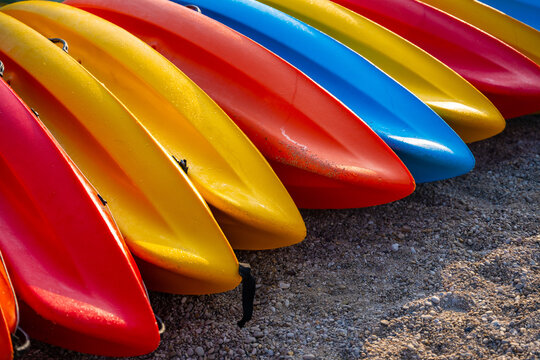 Colorful kayaks on a small stones sand in Turkey