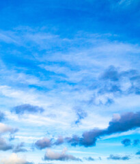 Blue sky with high and low clouds shot at 28 mm focal length