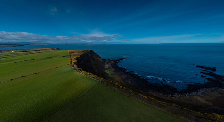 Drone panorama of cliffs and hexagonal stones or pillars at Giants causeway in northern ireland,...