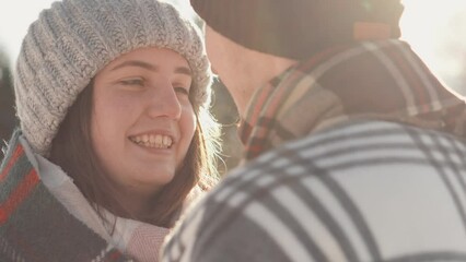 The romantic video is filled with warm moments love and happiness that please heart. Girl enjoys the company her boyfriend and smiles at him, looking into his eyes. Winter meeting and time together