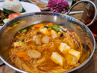 Tom yam noodles on bowl, ready to eat