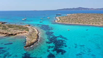 Aerial drone photo of azure paradise blue lagoon of Panteronisi a small islet complex between Paros...