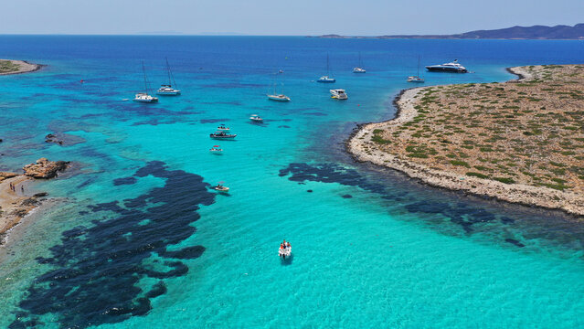 Aerial drone photo of azure paradise blue lagoon of Panteronisi a small islet complex between Paros and Antiparos islands, Cyclades, Greece