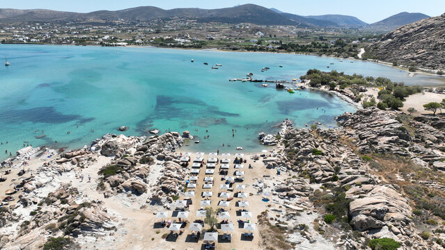 Aerial drone photo of famous small organised beach with unique rock formations of Kolimbithres or Kolympethres in the gulf of Naousa, Paros island, Cyclades, Greece