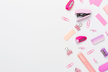 Pink school stationery on color backgroung, top view
