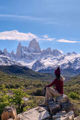 Naklejka na ściany i meble Woman sitting on the point view overlooking Mount Fitz Roy