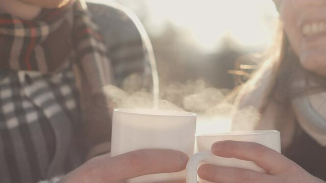 Romantic moments lightness and tenderness create emotional video young fallen in love couple in winter in nature. Cup coffee and chocolate. Cup of delicious tea. Man and woman warm themselves in cold.