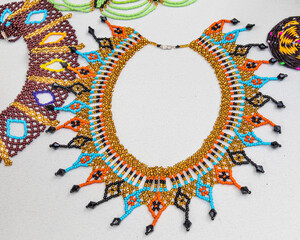Necklace of beads made by Quechua (Kichwa) women from ecuadorian Amazon region at the artisan's...