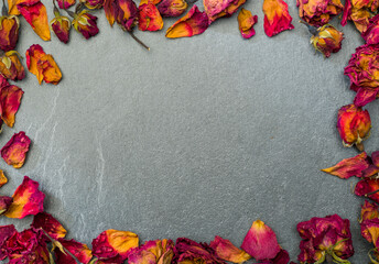 autumn background with dry rose petals for banner postcard background with free space for text