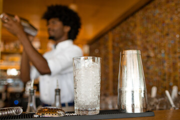 bartender preparing a drink behind the bar