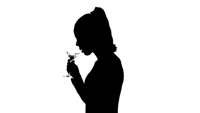 Silhouette Of Woman Drinking Martini