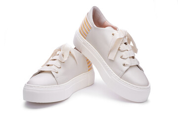 Stylish modern pastel sneakers with thick white rubber platform sole, multicolor detail on the back. Isolated on the white background, close up view.  Shoe sell mock-up