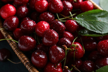 Wicker bowl with sweet cherries, closeup