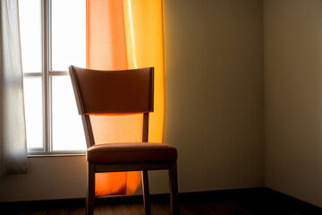 A Chair Sitting In Front Of A Window In A Room