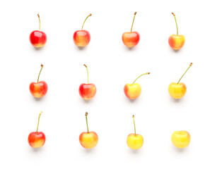 Many sweet yellow cherries on white background