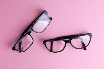 glasses for vision correction on a colored background with space for text