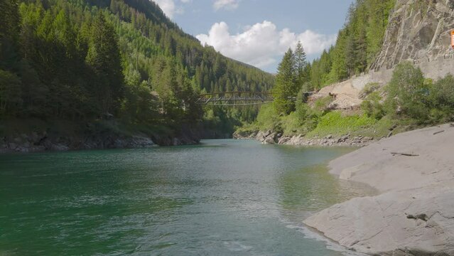 Mountain river entering the lake. Hinterrhein river and Lai da Seara Lake, B&auml;renburg reservoir. Exit of the famous Rofla Gorge, Rofflaschlucht. Andeer, Canton of Graub&uuml;nden in Switzerland
