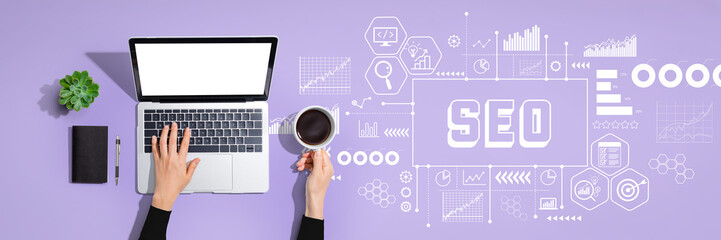 SEO - Search Engine Optimization theme with person using a laptop computer