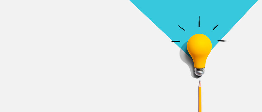 Idea light bulb with a pencil - flat lay