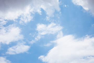 Obraz premium Clouds in the blue sky. Summer blue sky cloud gradient light white background. Beauty clear cloudy in sunshine calm bright winter air bacground. Image of beautiful blue sky.