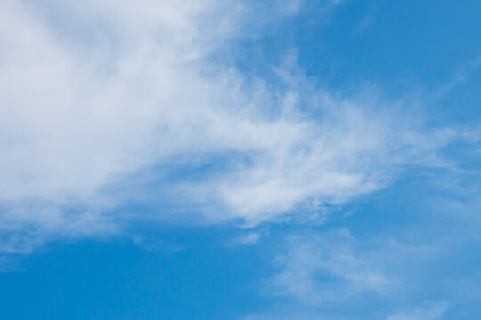 Clouds in the blue sky. Summer blue sky cloud gradient light white background. Beauty clear cloudy in sunshine calm bright winter air bacground. Image of beautiful blue sky.