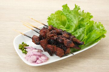 Satay or Sate with chili, ​​shallot and lettuce. Indonesian traditional food
