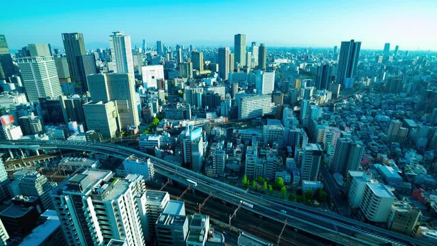 A dusk timelapse of panorama cityscape near the railway in Osaka wide shot zoom