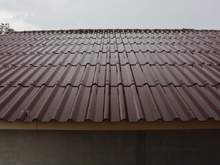 Brown tiled roof on a rainy day