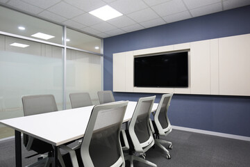 Modern meeting room with wide screen TV